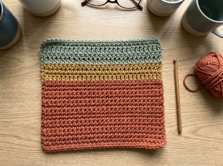 Photorealistic AI render of a finished crochet piece generated from a stitch chart in the Crochets app